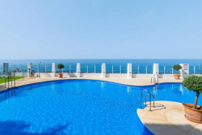 Beachfront 2BR with swimming pool, parking & AC